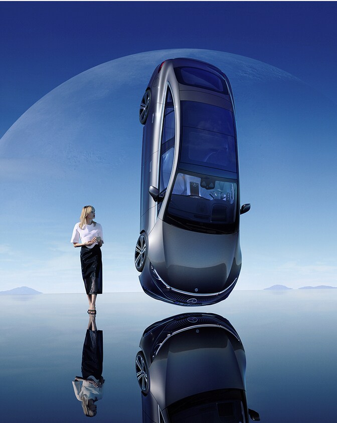 Integrated Service Package | Mercedes-Benz A woman stands right beside a hovering Mercedes-Benz car.